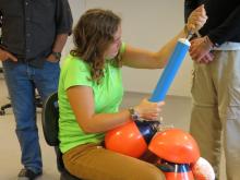 Courtney is pumping up the buoys that will float atop the drogues