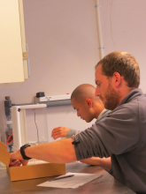 Ryan and Kean are massing and labeling petri dishes and filters in preparation for sediment sampling