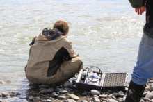 Sampling water at river