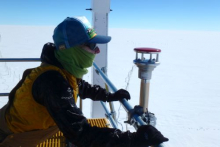 Science Technician Installing Weather Instrument