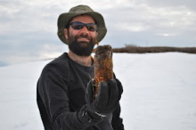 Anthony Darrouzet-Nardi with soil core taken from study plot at Imnaviat