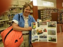 setting up ECW gear display at library for the summer