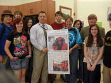 Principal of Macon Early College, Mr. Todd Gibbs, presenting Ms. Steiner with la