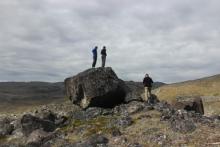 Standing on an erratic