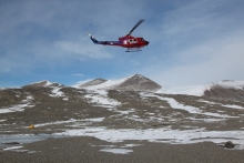 A helicopter arrives at New Harbor