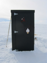 outhouse with water drop