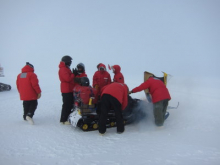 Fixing a ski-doo on the ice