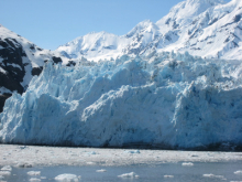 Icebers with blue ice with the glacier