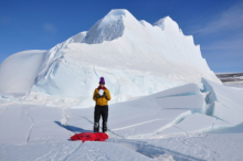 The WATER DROP with Sally in front of an iceberg.