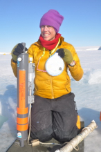 Sally with her Niskon water sample  bottle to get the pH of the water.