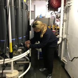 Piper Bartlett-Browne taking bottom water samples from the CTD.