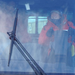 Amy Osborne in the driver's seat of a Pisten Bully.