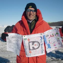 Gregg holding flags