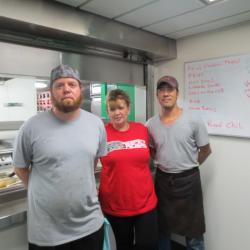 Mike the chief steward with Lorenzo and Marsalla his galley mates.