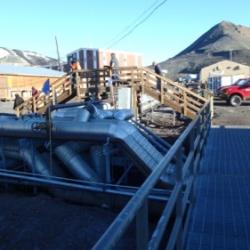 Crossing a bridge over exposed pipes at McMurdo