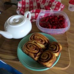 Berries, tea and cinammon rolls