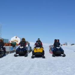 Scientists on snowmobiles