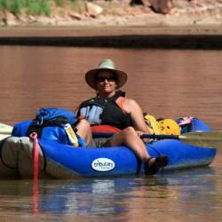 Lesley floating the San Juan in her inyak