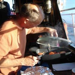  Steve cooking dinner on the Annika Marie.  note the beautiful weather outside.