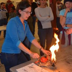 Michelle Brown lights a stove