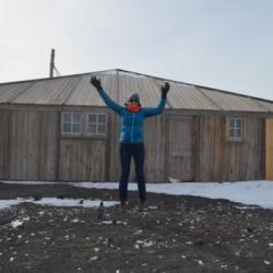 Michelle Brown in front of Discovery Hut