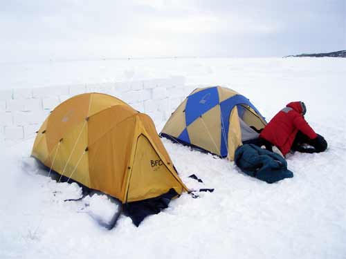 Mountain tents and snow wall